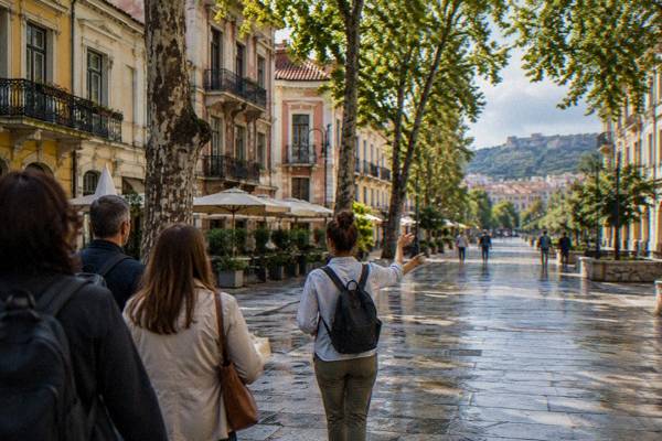 Small guided group from behind on a cobbled Old Town street in Plovdiv