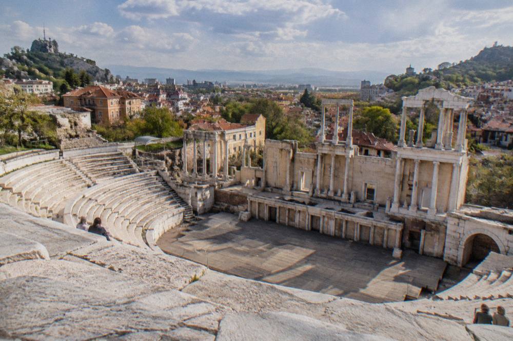 The stone seats of the Ancient Theatre of Philippopolis overlooking the city rooftops