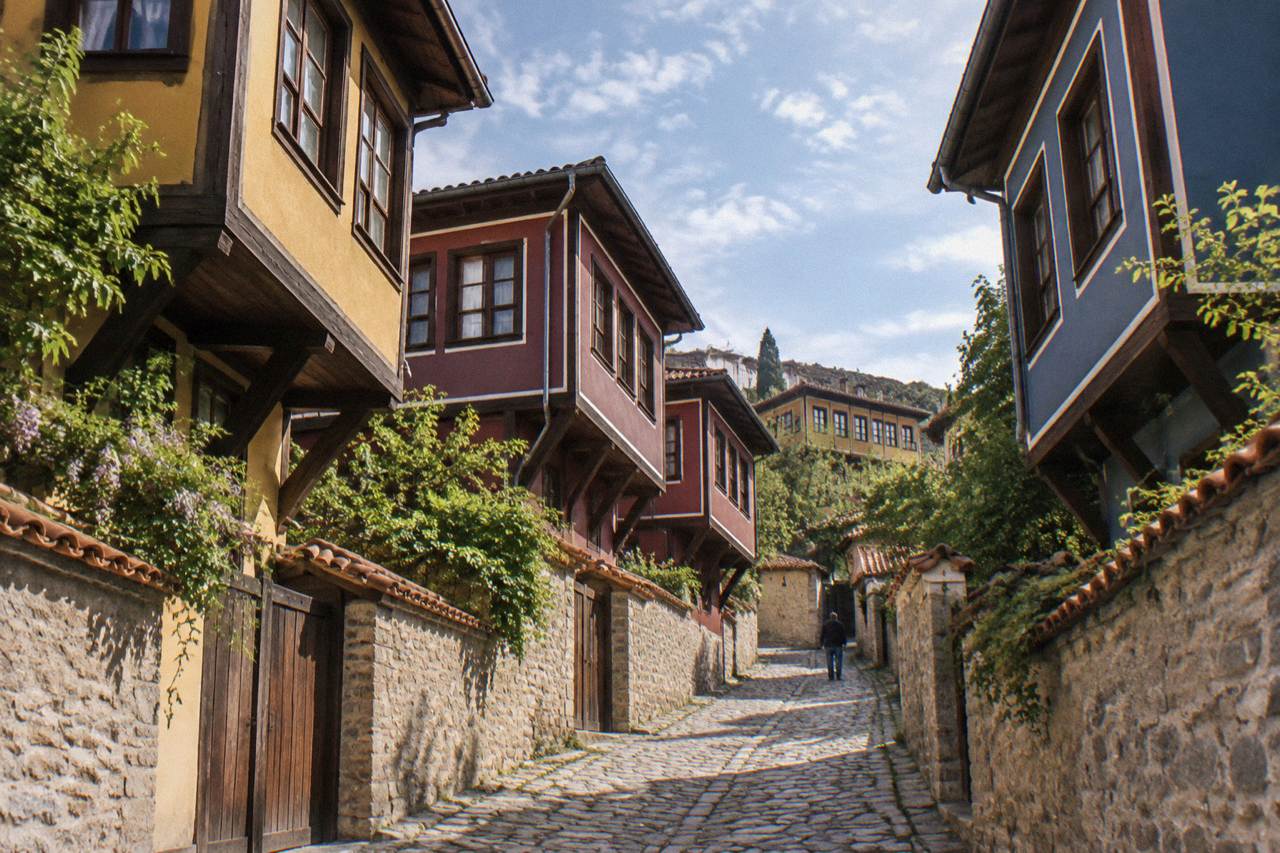 Cobbled street in the Old Town of Plovdiv with colourful revival-era houses on a hillside