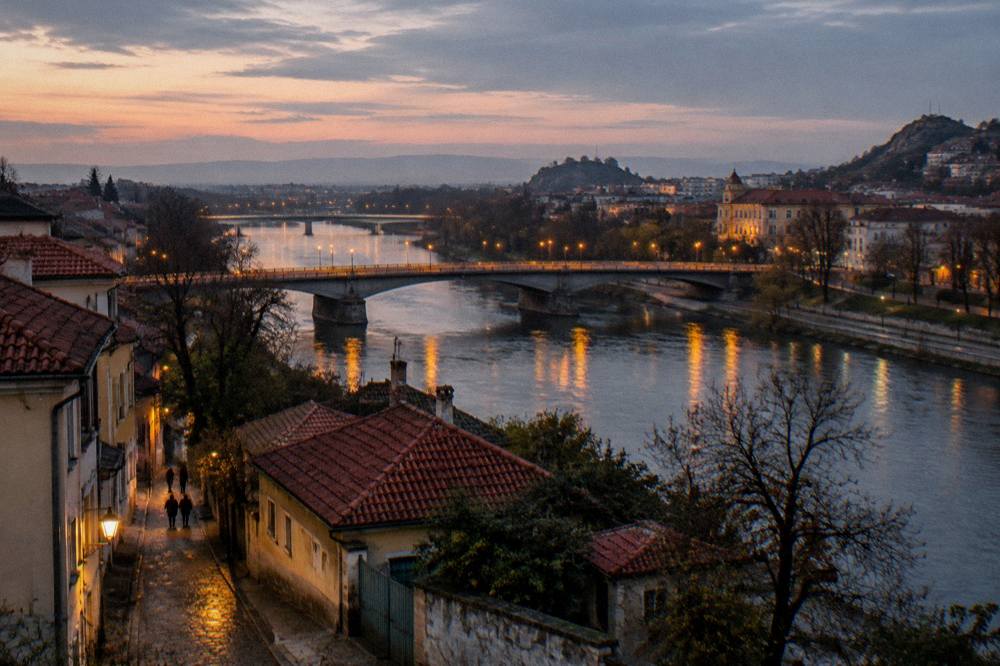 The bridges over the Maritsa at dusk with lights reflecting on the water