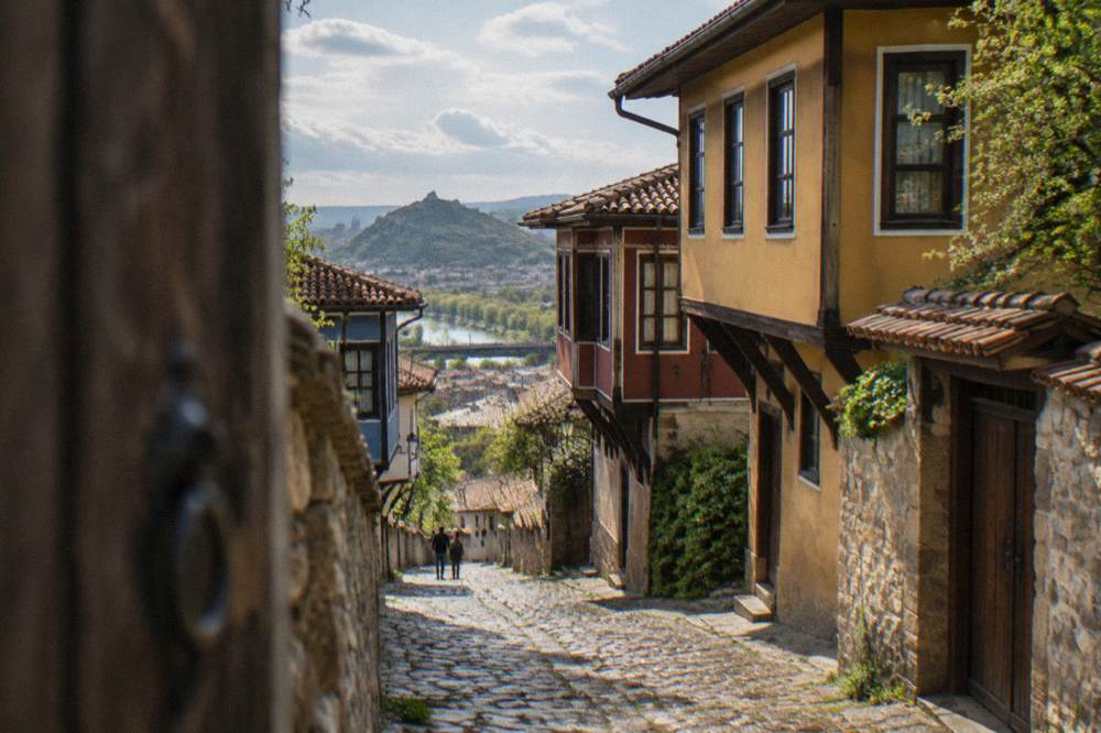 Steep cobbled lane between Bulgarian Revival houses on the Old Town hill