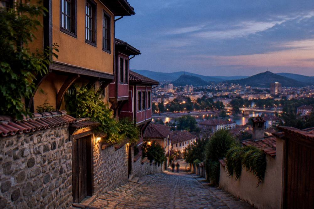 Evening panorama from a Plovdiv hill with city lights spreading below