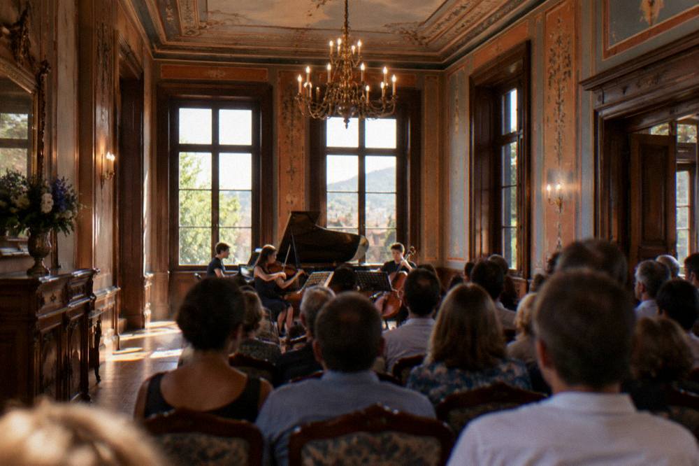 Evening concert audience seated in a salon of a Revival mansion in Plovdiv