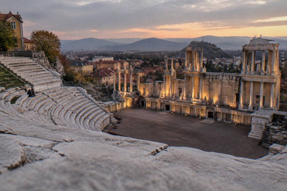 Evening light on the Ancient Theatre stage with the Rhodope hills beyond