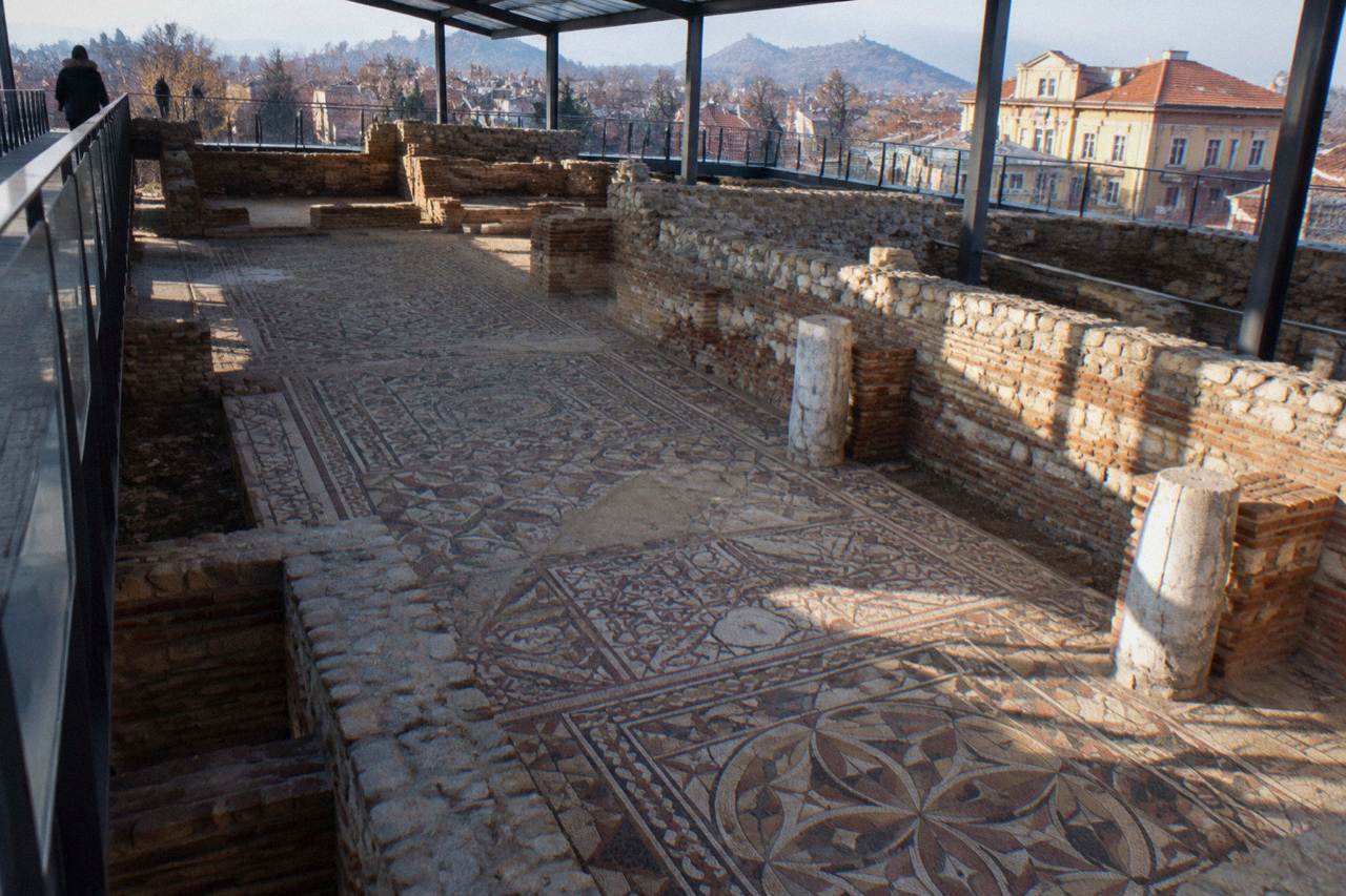Ancient floor mosaics of the Episcopal Basilica of Philippopolis seen from an elevated walkway in Plovdiv