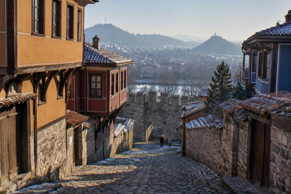 Cobbled lane in Plovdiv Old Town leading down toward the Hisar Kapia gate