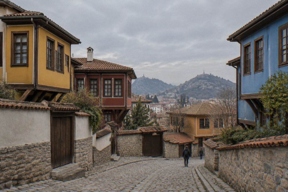 Colourful Old Town houses on a cobbled street above the gate in Plovdiv