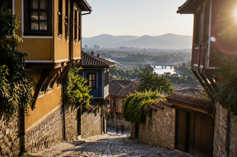 View from Plovdiv Old Town toward the city below with the Rhodope hills on the horizon