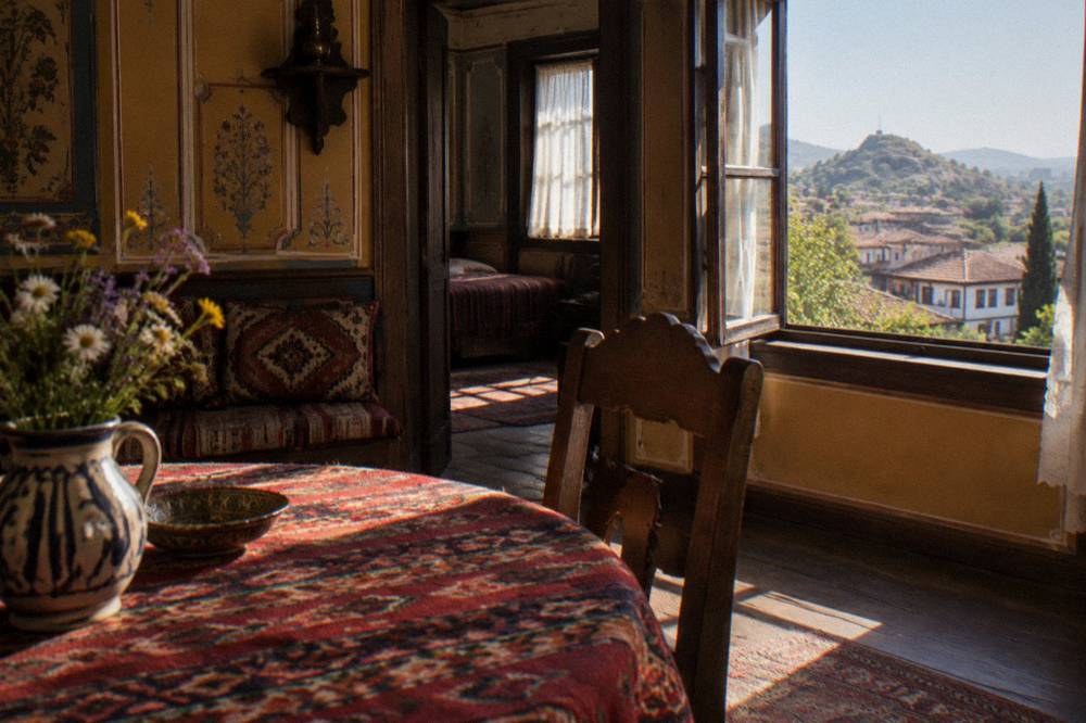 A painted revival-era interior room with period furniture and patterned walls in a Plovdiv house