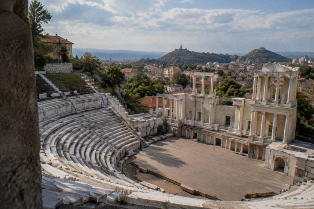The marble seating rows of the Ancient Theatre of Philippopolis under an open sky in Plovdiv