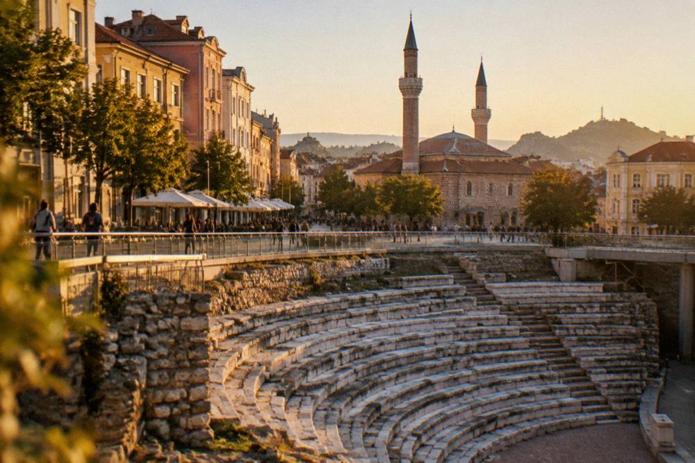 The Dzhumaya Mosque minarets rising beside the open square above the Roman Stadium in Plovdiv
