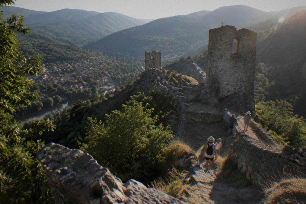 Green Rhodope hillsides in early summer with a small town in the valley below