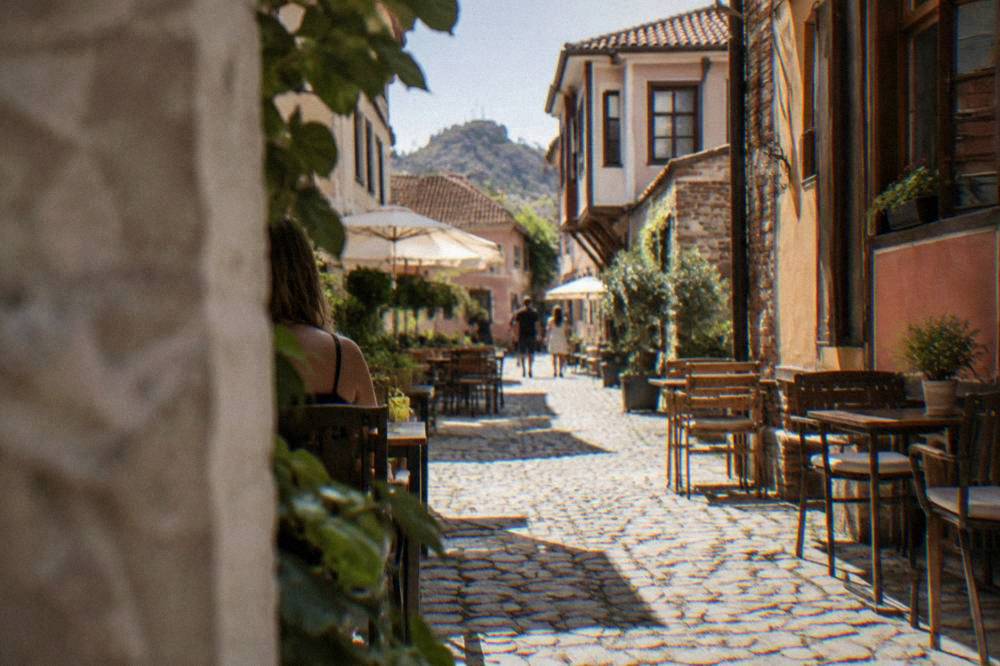 Narrow cobbled lanes in the Kapana district of Plovdiv lined with small cafes and tables outside