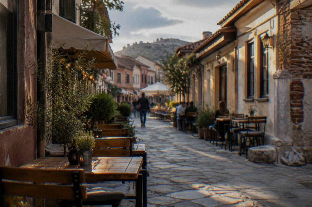 Evening tables set outside small restaurants in the narrow streets of Kapana in Plovdiv