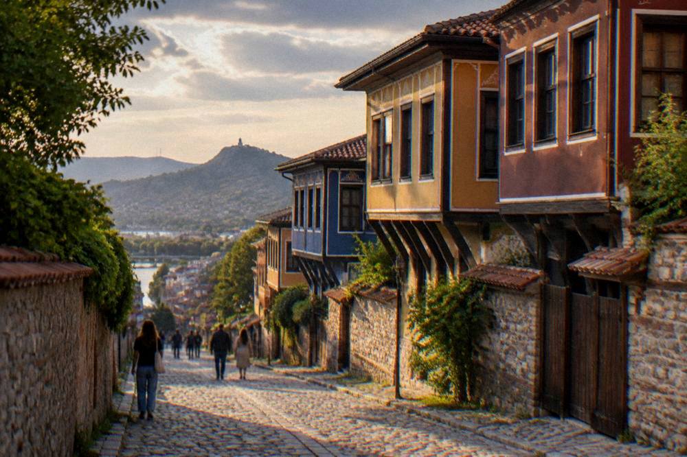 The illuminated main pedestrian street of Plovdiv seen from the bus station side in the evening