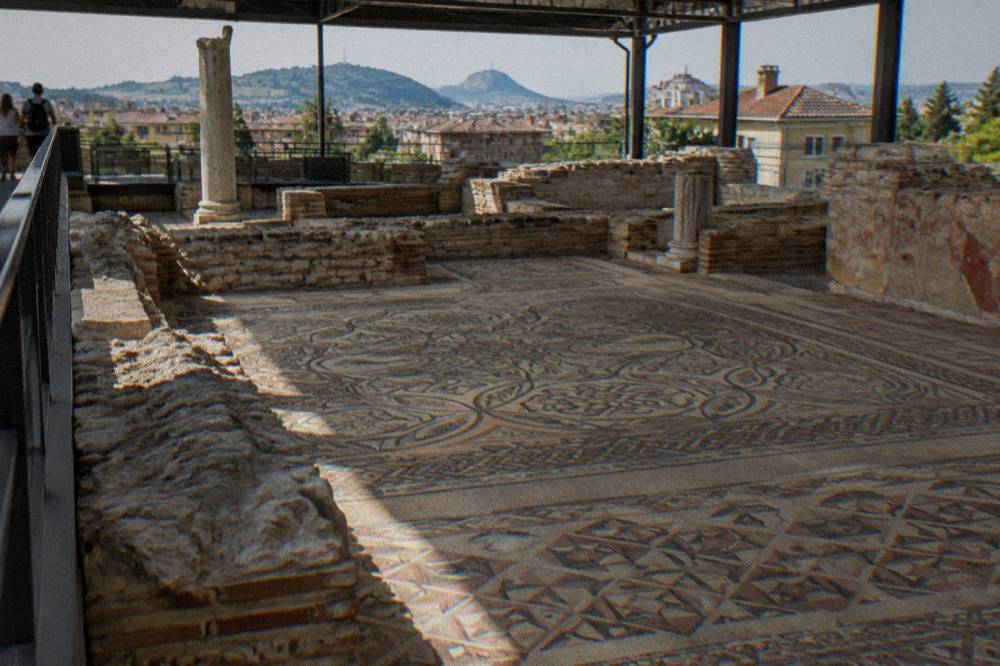 Ancient mosaic floor of the Bishop's Basilica viewed from a raised walkway in Plovdiv