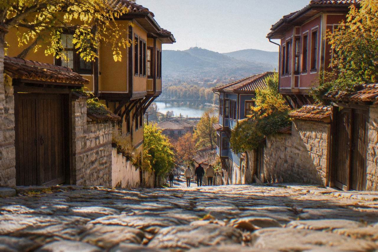 Cobbled street in Plovdiv Old Town lined with revival-era houses under warm autumn light