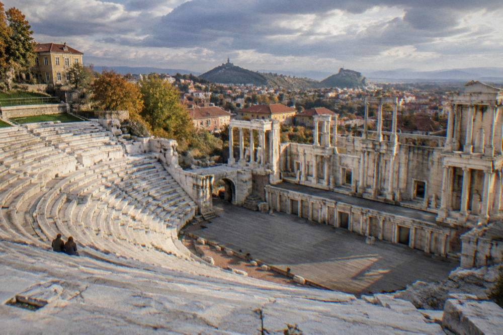 The Ancient Theatre of Philippopolis with marble rows of seats empty on a calm autumn morning
