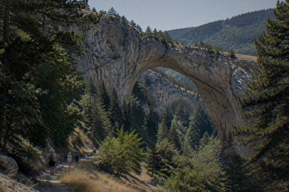 The stone arch of the Wonderful Bridges rock formation in the green Rhodope mountains