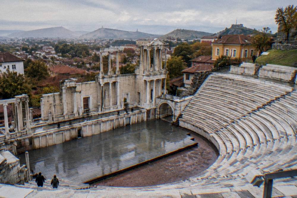 Marble rows of the Ancient Theatre of Philippopolis seen from the stage in afternoon light