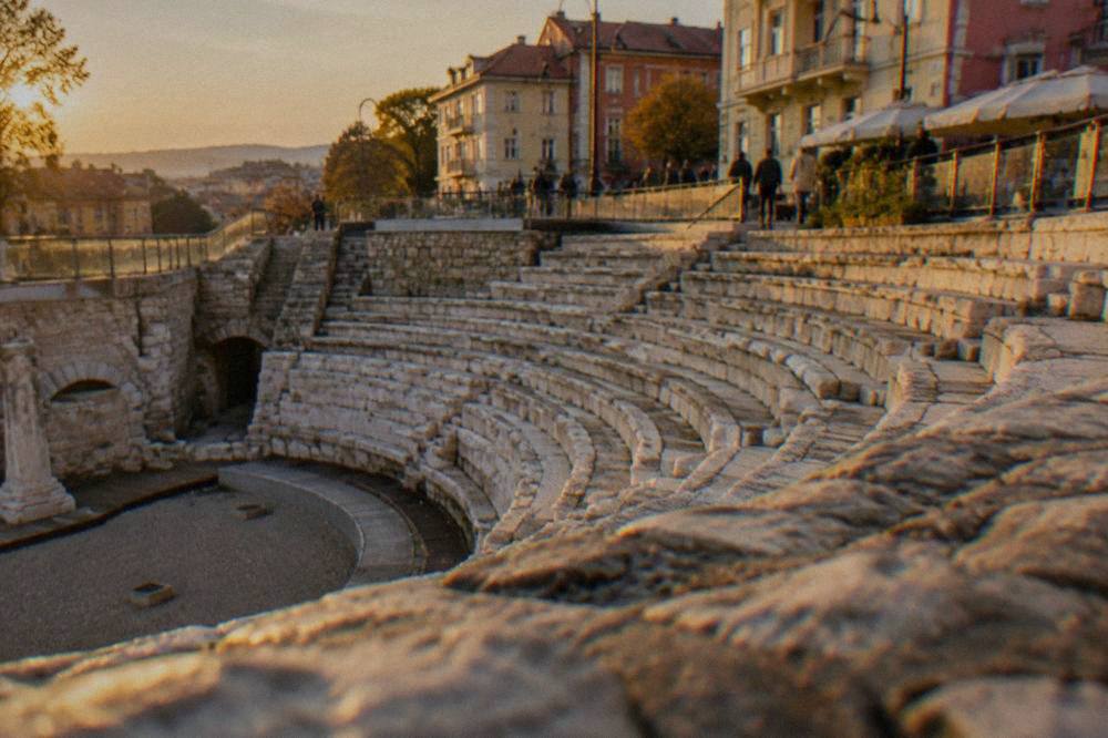 Stone seats of the Roman Stadium sphendone in Plovdiv seen from below street level