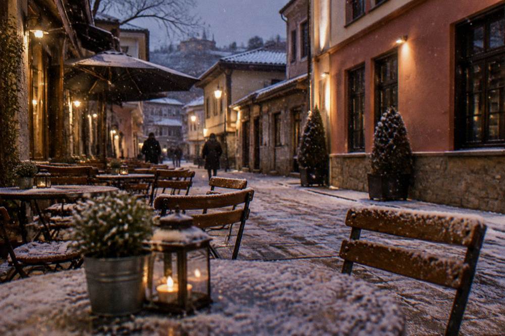 Outdoor cafe tables in a pedestrian lane at night