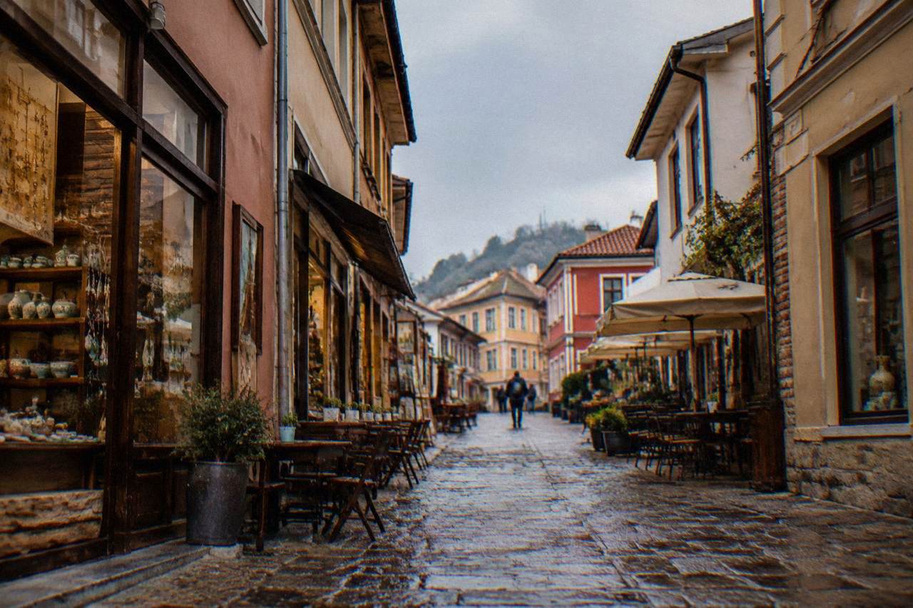 Narrow cobbled street in the Kapana quarter of Plovdiv lined with small artisan shopfronts