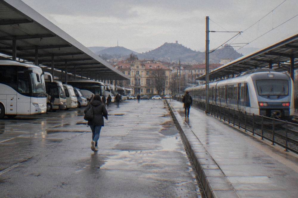 Modern passenger train waiting at a Bulgarian railway platform in daylight