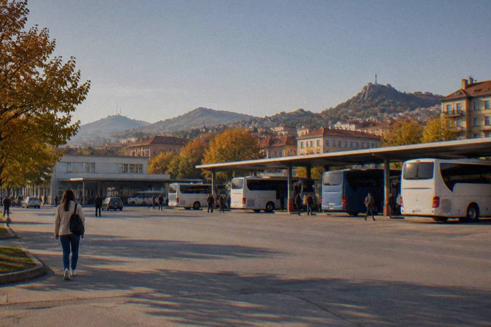 View over red rooftops and hills of a southern Bulgarian city in autumn light