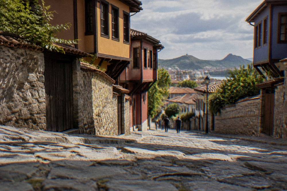 A pedestrian street in central Plovdiv leading from the station district toward the Old Town hills