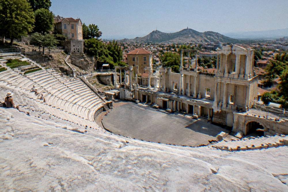 The Ancient Theatre of Philippopolis under a clear summer sky with its marble rows of seats