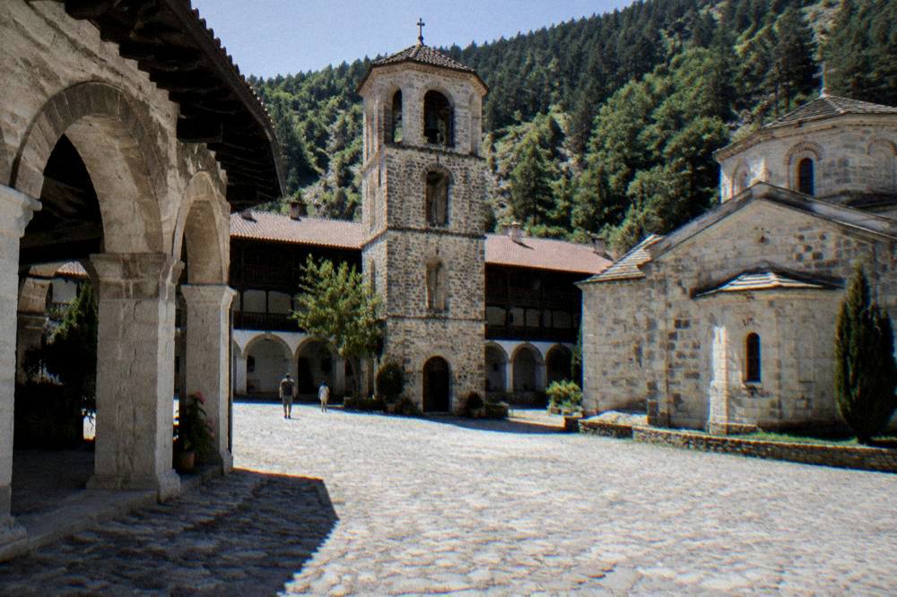 Stone arches of Bachkovo Monastery courtyard in the Rhodope hills