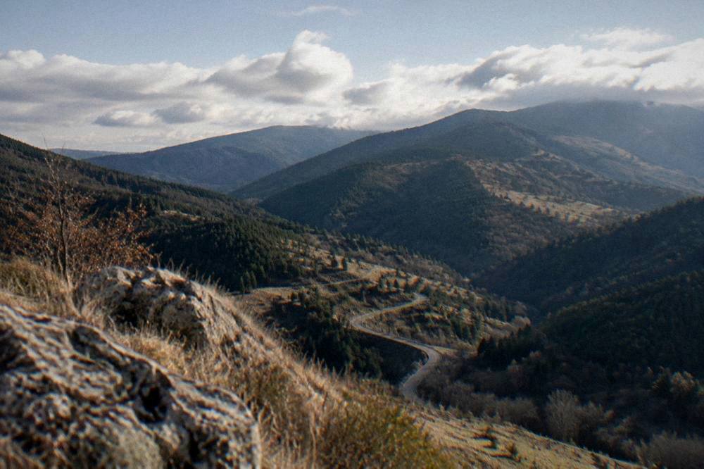 Clouds drifting over the green slopes of the Rhodope Mountains seen from a viewpoint above Plovdiv