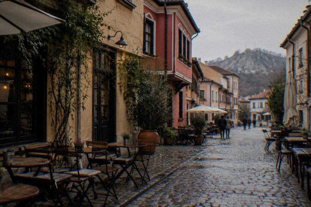 Narrow cobbled street in the Kapana district with small cafes and painted facades