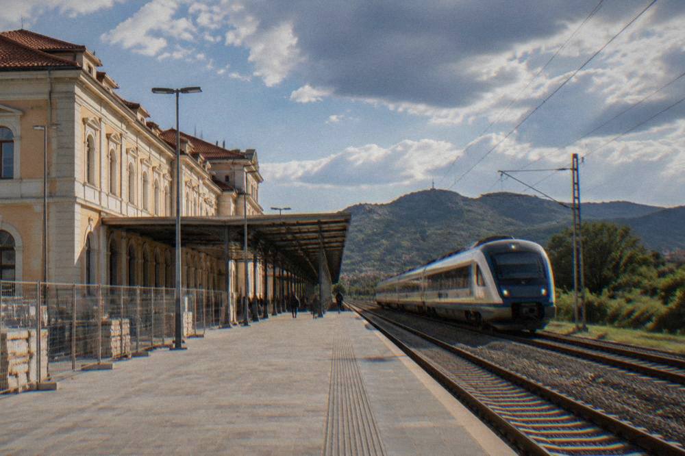 A modern intercity train travelling through green countryside in southern Bulgaria