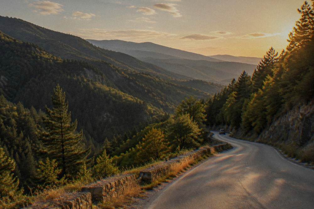 Winding mountain road in the Rhodope Mountains with forested slopes