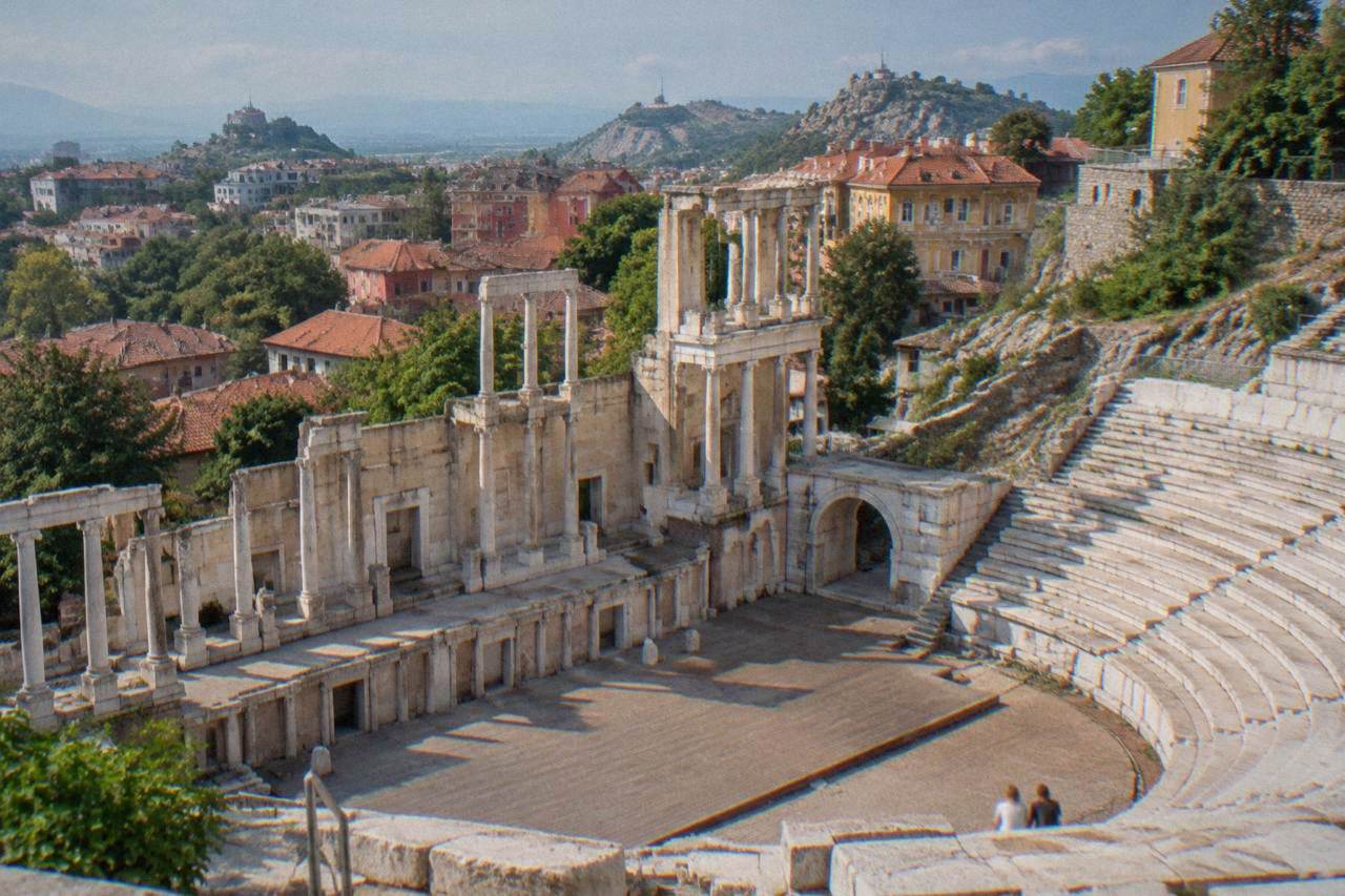 The restored Ancient Theatre of Philippopolis with its marble rows of seats below Plovdiv's Old Town houses