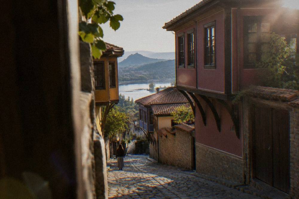 Narrow cobbled street in Plovdiv Old Town with National Revival houses on both sides