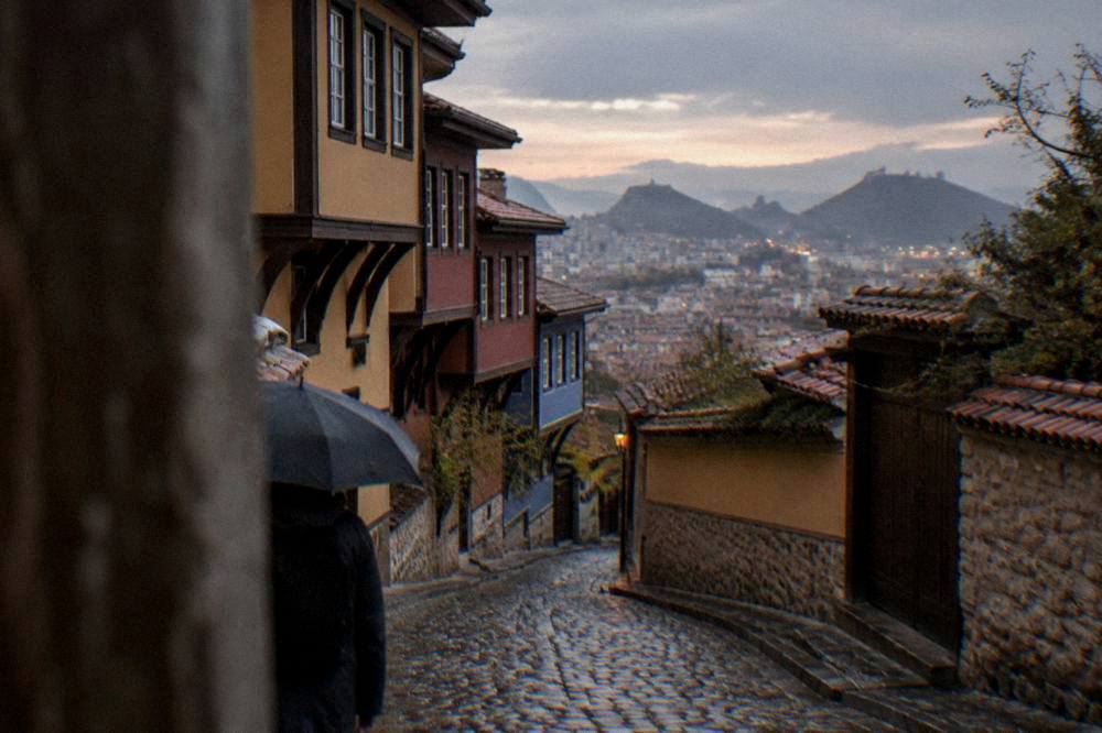 The city lights of Plovdiv spread below the hills at dusk