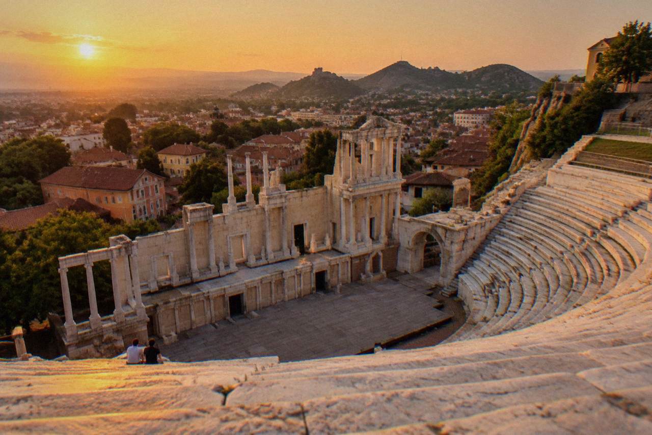 The Ancient Theatre of Philippopolis seen from its upper marble rows above the red roofs of Plovdiv Old Town