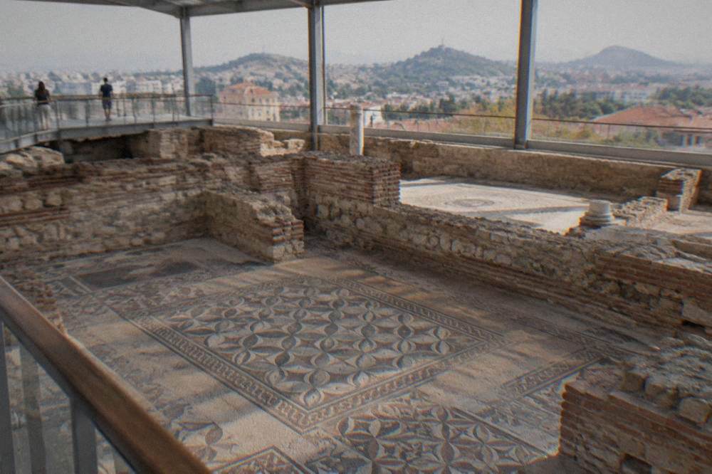 Mosaic floor of the Bishop's Basilica viewed from a raised walkway inside the visitor centre