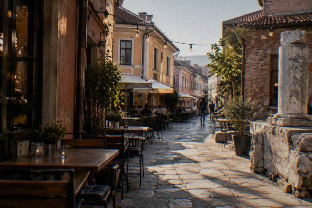 Evening lights and outdoor tables in the narrow lanes of the Kapana creative district