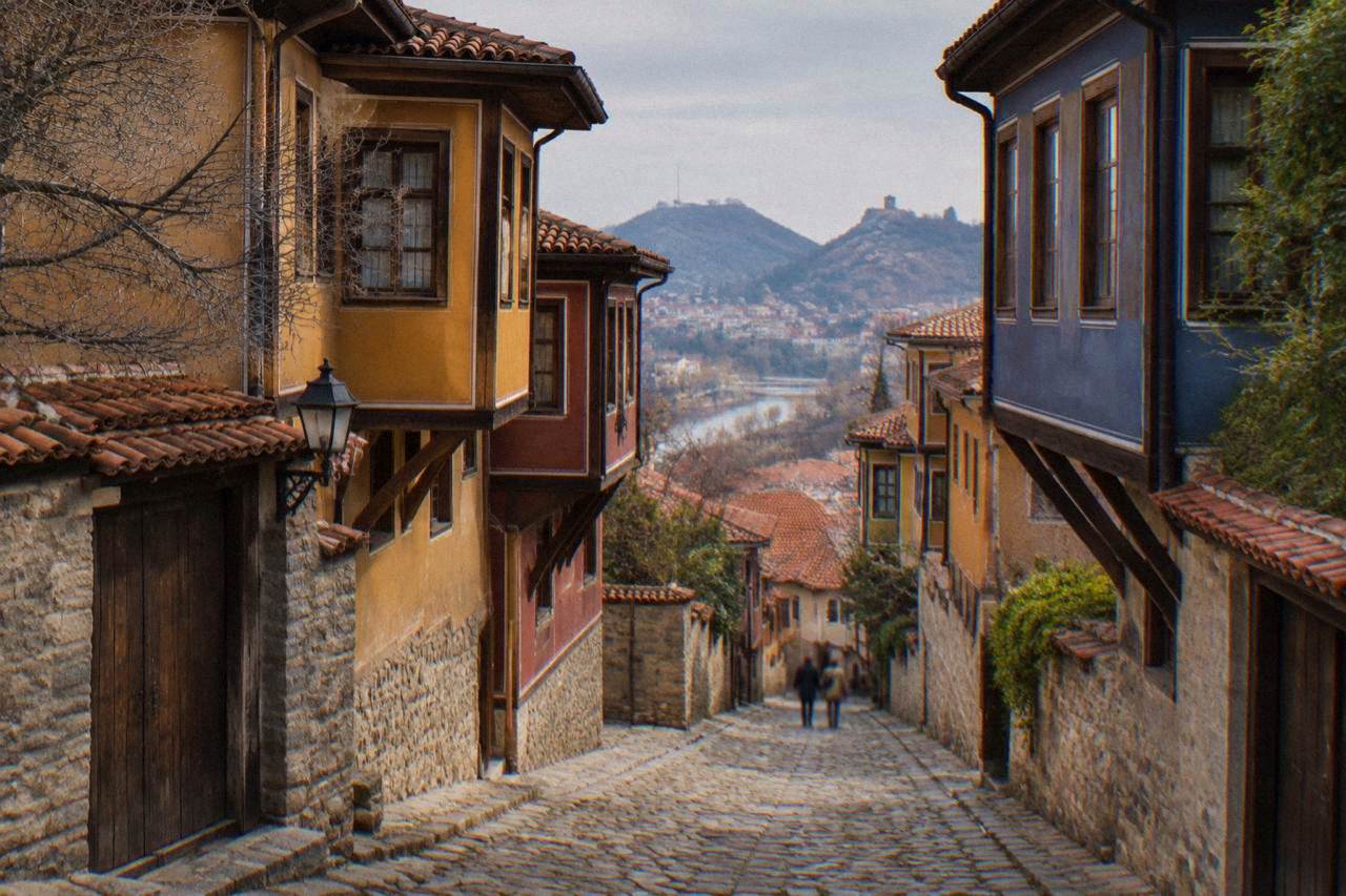 Cobblestone street in Plovdiv Old Town lined with colourful revival-era houses