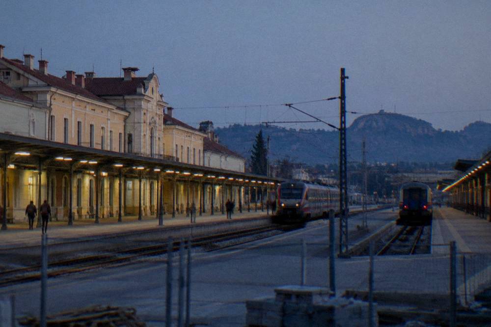 Plovdiv central railway station platform with trains under a clear sky