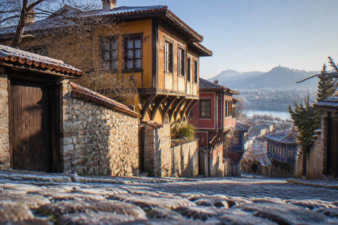Cobbled street in Plovdiv Old Town with colourful revival-era houses on a hillside