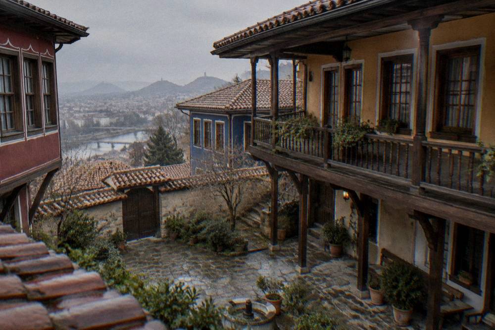 Courtyard of a traditional Bulgarian revival house with wooden verandas
