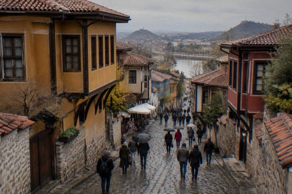 Pedestrian shopping street in Plovdiv with crowds and historic facades
